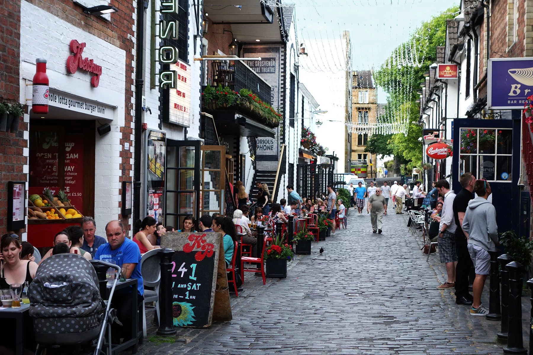 Ashton Lane is lined with an array of restaurants and bars, most with tables out front and convivial gardens in the back
