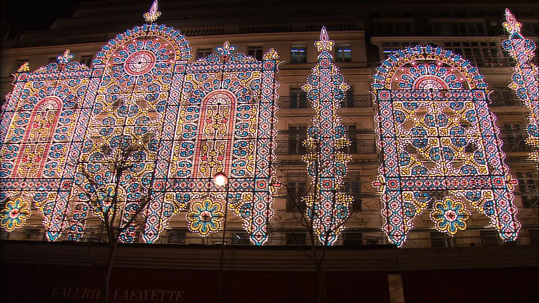 The facade of Galeries Lafayette — a major department store — is decorated with thousands of lights at Christmastime