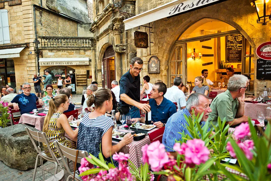 Lingering in outdoor cafés is the norm in France — eat long and well